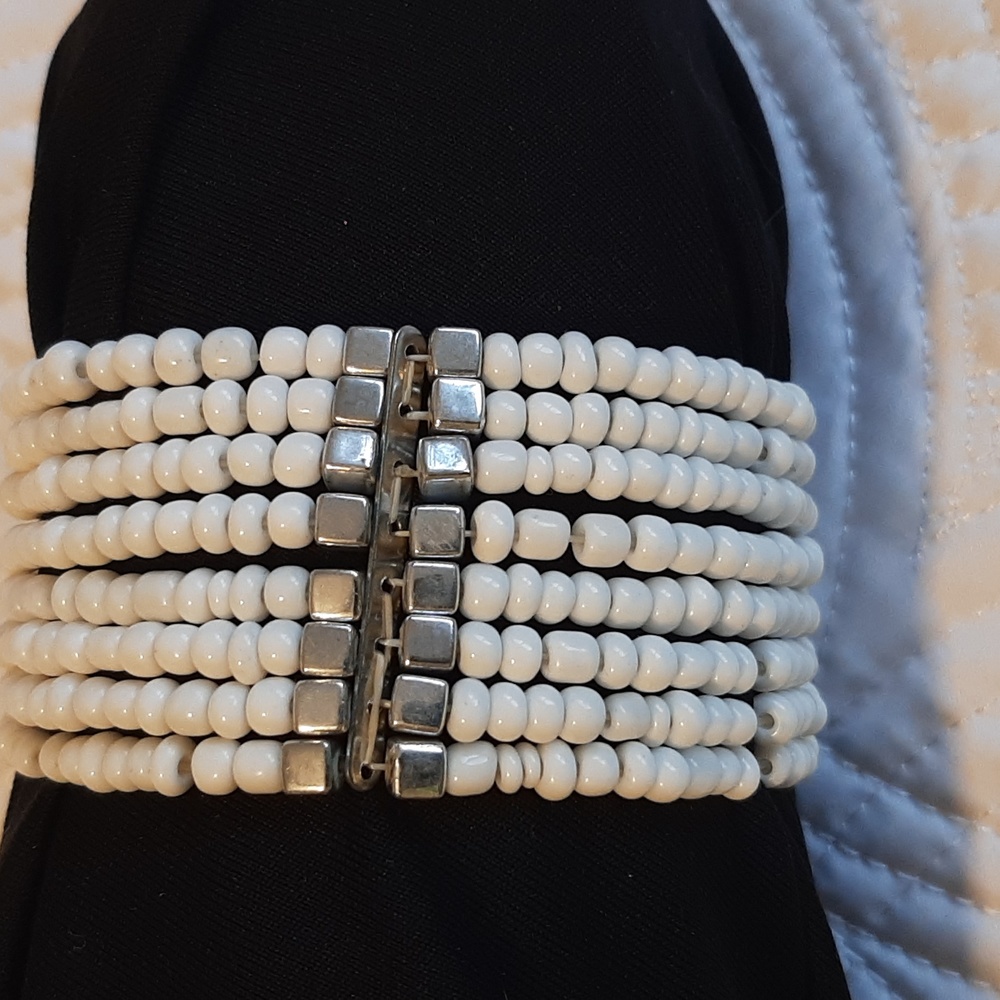Wrap bracelet with seed beads.  Silver trim. Fits all sizes.